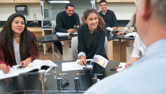 multiple students in a science classroom with an instructor
